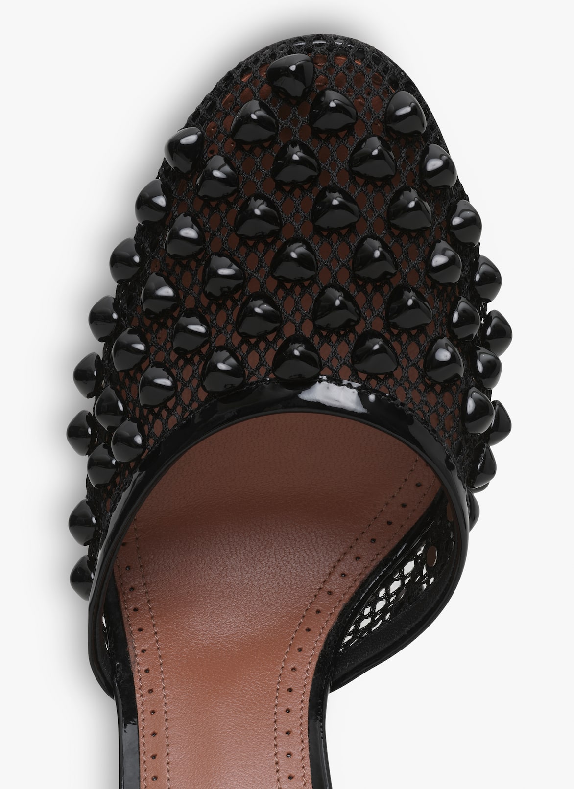 HIGH FISHNET PUMPS WITH STUDS ALAÏA BLACK HIGH FISHNET PUMPS WITH STUDS